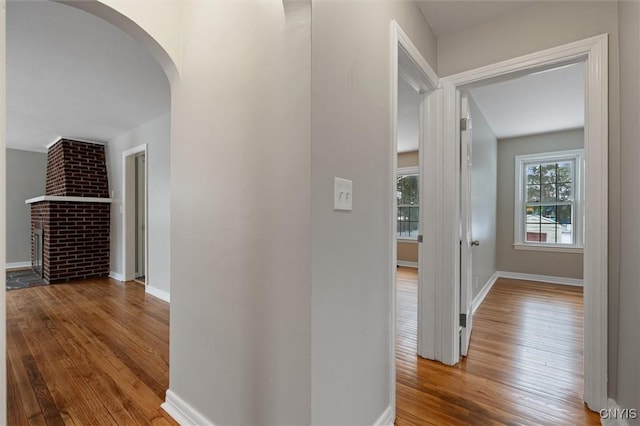 corridor featuring wood-type flooring