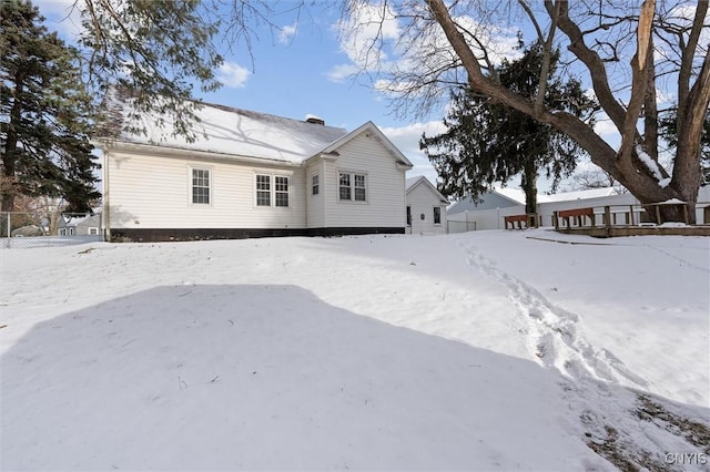 view of snow covered house