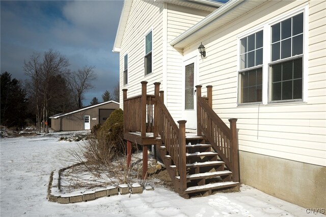 view of snow covered property entrance