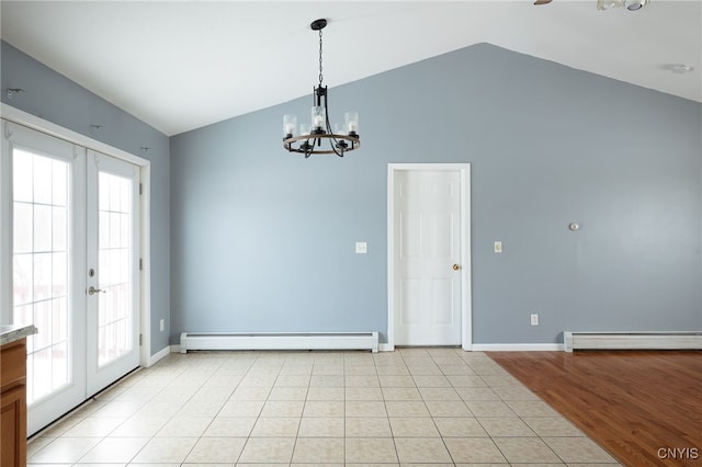 interior space featuring a baseboard heating unit, french doors, light tile patterned floors, and lofted ceiling