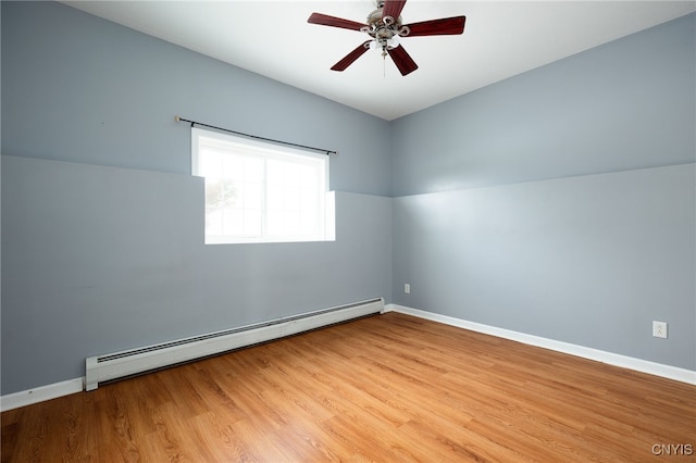 unfurnished room with a ceiling fan, a baseboard radiator, baseboards, and wood finished floors