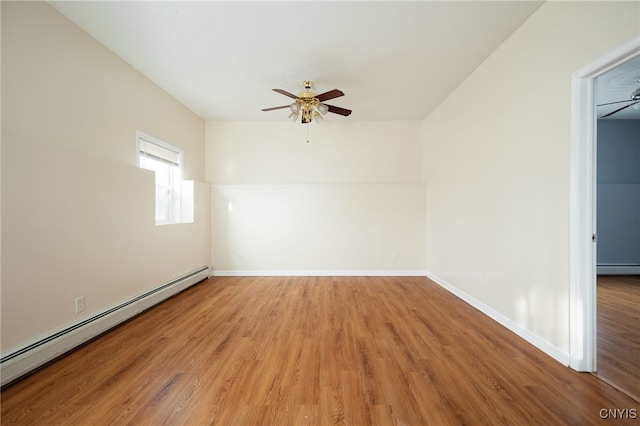 unfurnished room featuring light wood finished floors, a baseboard radiator, a ceiling fan, and baseboards