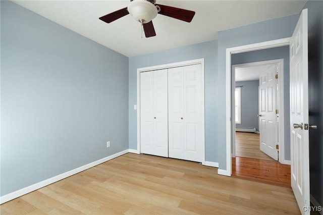 unfurnished bedroom featuring baseboards and light wood finished floors