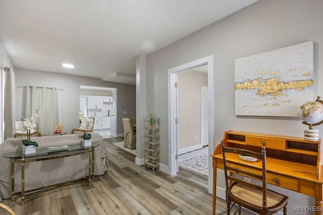 hall with light hardwood / wood-style floors