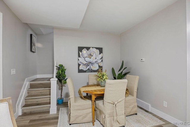 dining area featuring light wood-type flooring