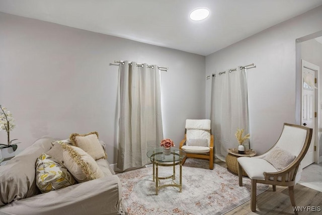 sitting room with hardwood / wood-style flooring