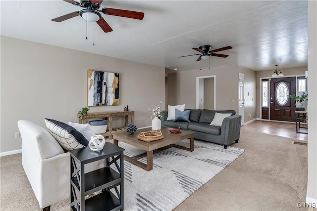 carpeted living room featuring ceiling fan