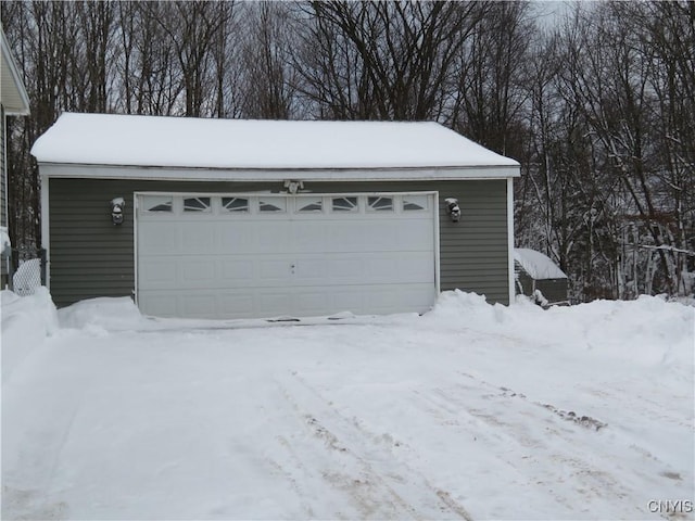 view of snow covered garage