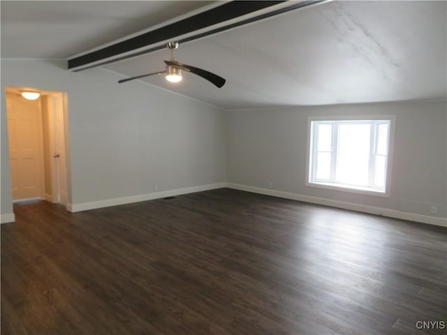 spare room featuring ceiling fan, dark hardwood / wood-style flooring, and lofted ceiling with beams