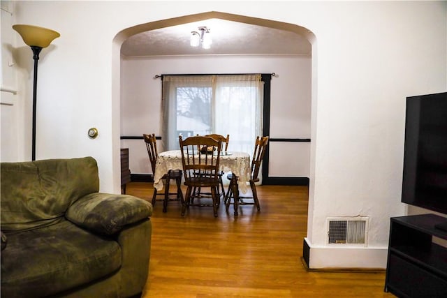 dining space featuring hardwood / wood-style flooring