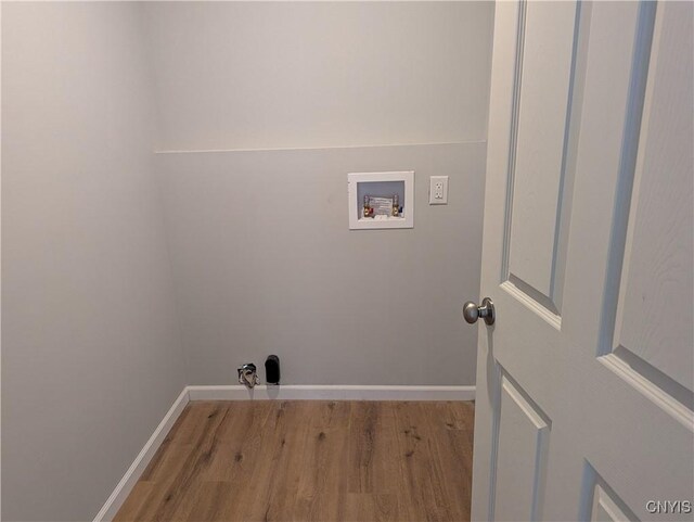 6661 Pine Grove Rd, Watson, NY 13343 - washroom with hookup for a washing machine and wood finished floors
