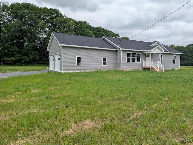 6661 Pine Grove Rd, Watson, NY 13343 - rear view of house with a garage, roof with shingles, and driveway
