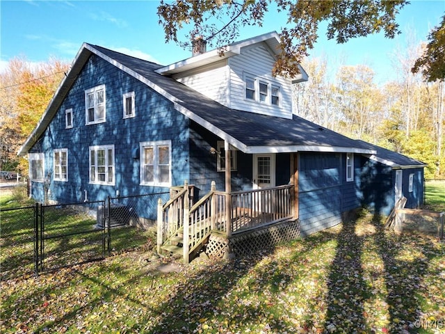 rear view of property featuring a lawn