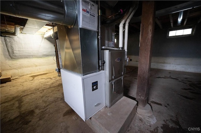 utility room featuring heating unit