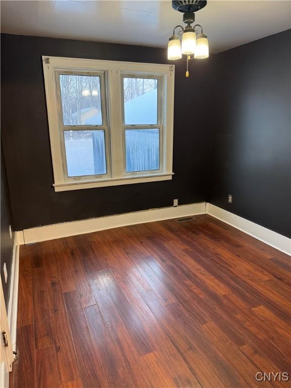 empty room featuring dark hardwood / wood-style floors