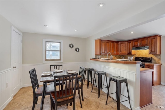 dining room with sink and light tile patterned floors