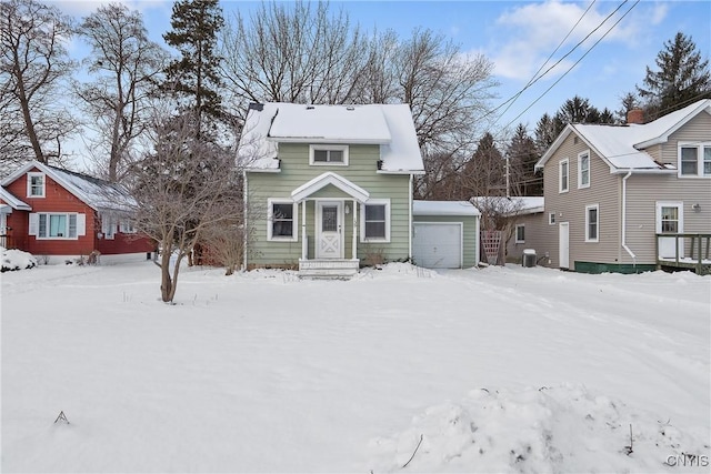 view of property with central AC and a garage