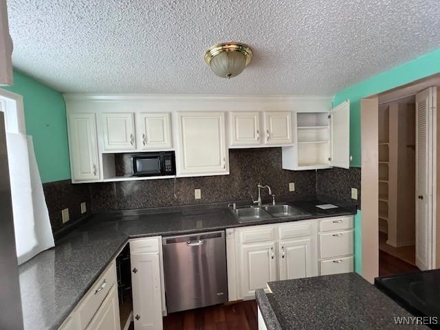 kitchen featuring dishwasher, white cabinets, sink, decorative backsplash, and dark hardwood / wood-style flooring