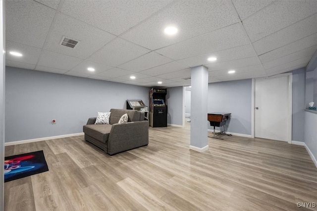 living room featuring a paneled ceiling, hardwood / wood-style floors, and pool table