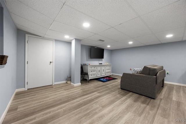 sitting room with wood-type flooring