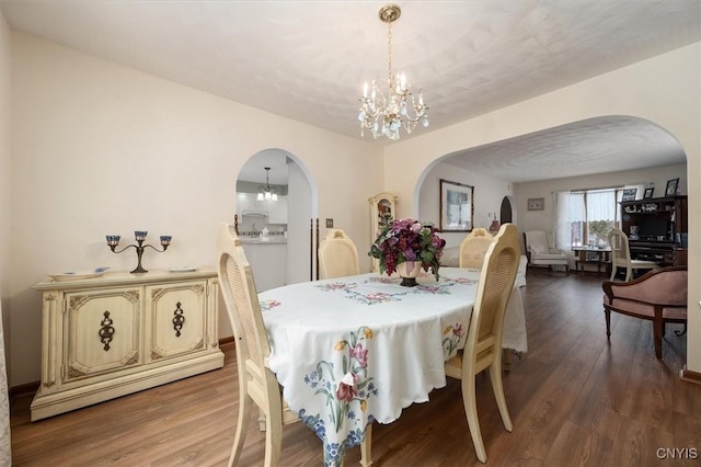 dining room featuring a chandelier and hardwood / wood-style floors