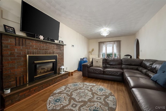 living room featuring a fireplace and hardwood / wood-style flooring