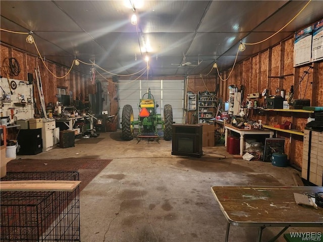 interior space featuring concrete flooring and a workshop area