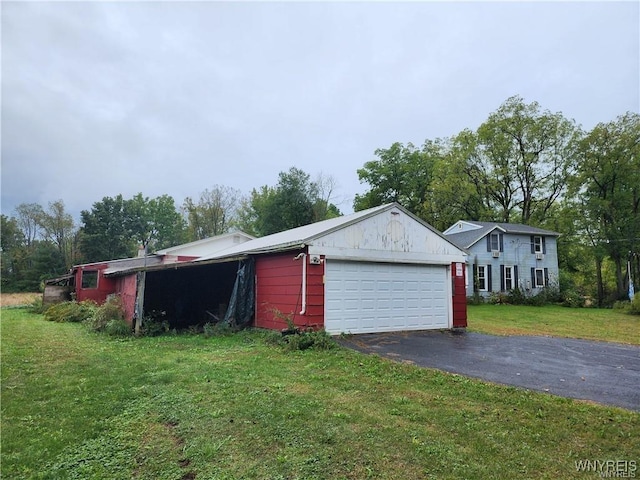 exterior space with a yard and a garage