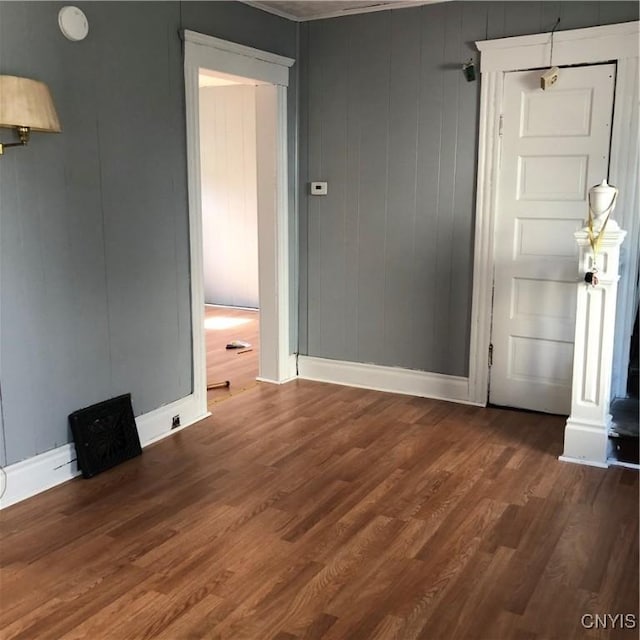 spare room with dark hardwood / wood-style floors