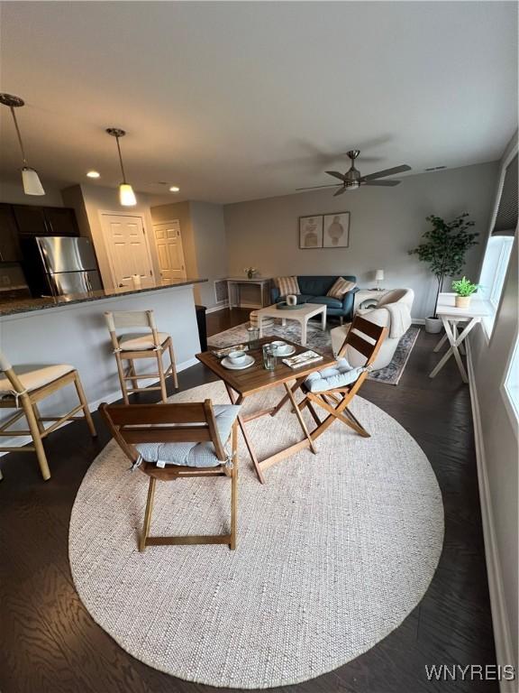 8977 Iroquois St, Evans, NY 14006 - living room featuring ceiling fan and dark hardwood / wood-style flooring
