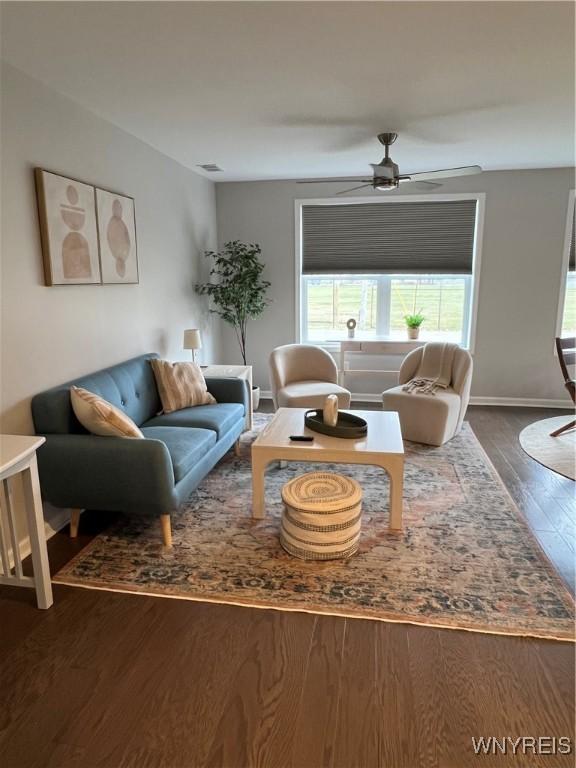 8977 Iroquois St, Evans, NY 14006 - living room featuring dark wood-type flooring and ceiling fan