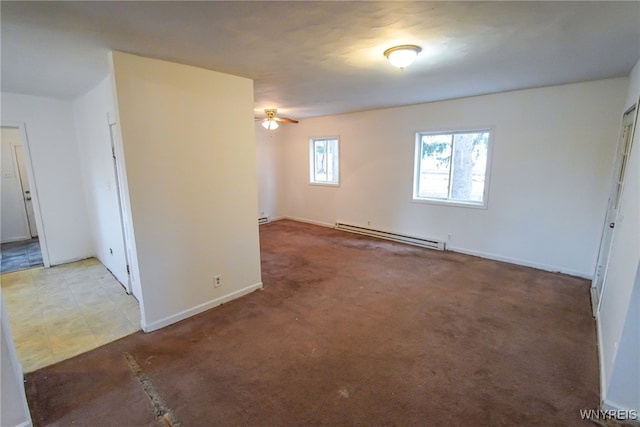 carpeted empty room featuring a baseboard radiator