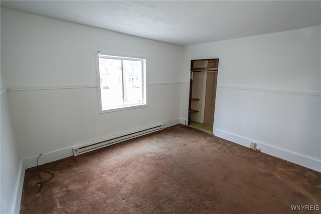 unfurnished bedroom with baseboard heating and carpet flooring