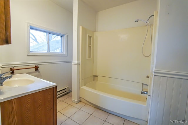 bathroom with vanity, bathing tub / shower combination, tile patterned floors, and baseboard heating