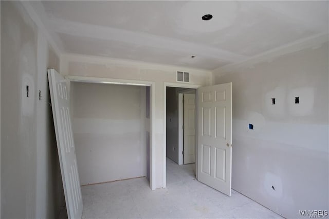 unfurnished bedroom with a closet