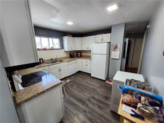 kitchen featuring white cabinets, white appliances, dark hardwood / wood-style floors, and sink