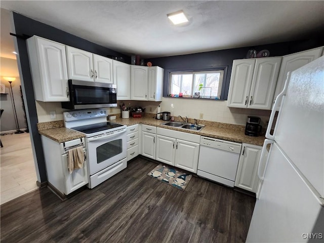 kitchen with white cabinetry, dark hardwood / wood-style flooring, white appliances, and sink