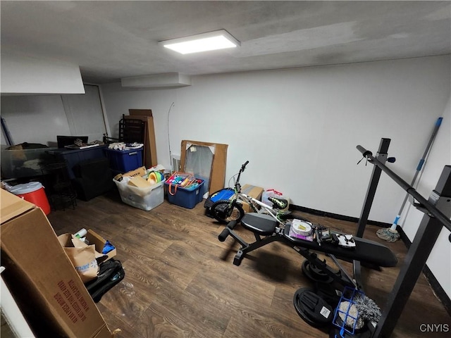 workout room with dark wood-type flooring