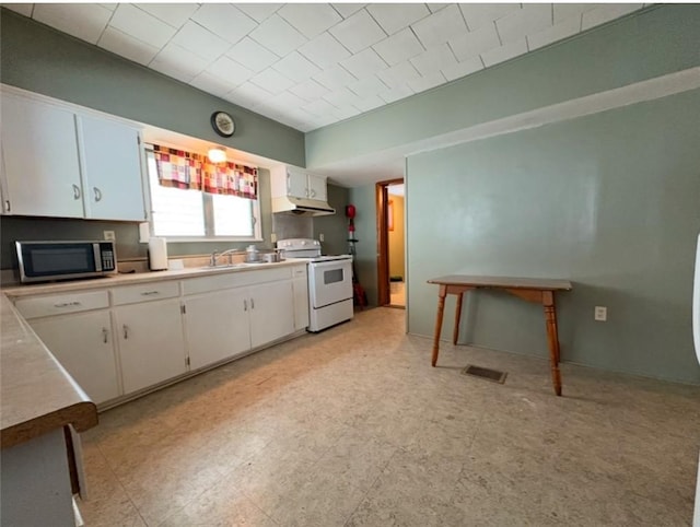 kitchen featuring sink, white cabinets, and white electric range