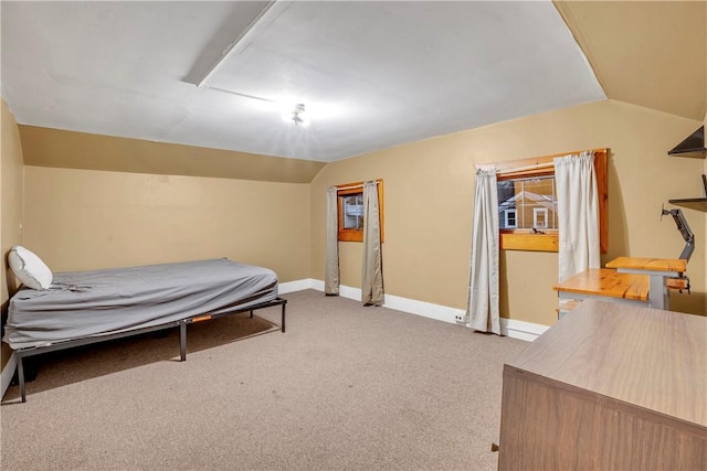 carpeted bedroom featuring vaulted ceiling