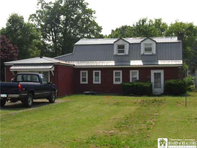 130 E Mosher St, Ellicott, NY 14733 - colonial inspired home featuring a front yard, metal roof, and a chimney