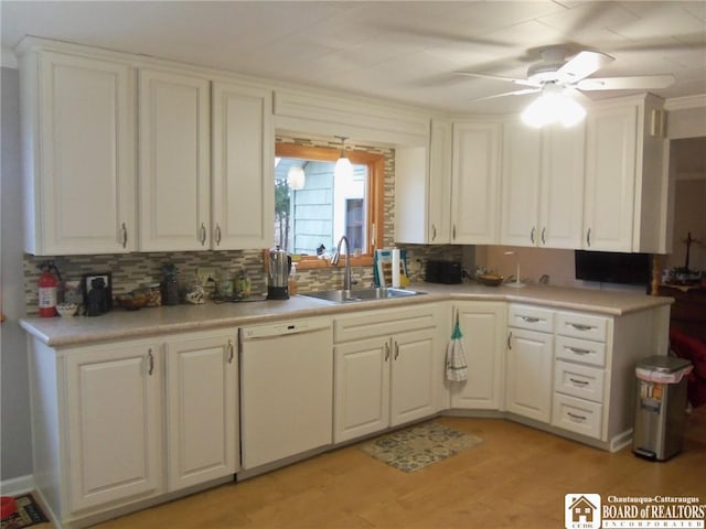 kitchen with backsplash, white dishwasher, ceiling fan, sink, and white cabinets