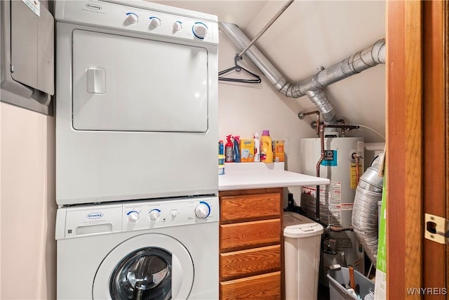 washroom with stacked washing maching and dryer and water heater