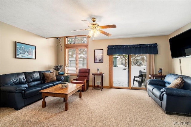 living room with carpet flooring and ceiling fan