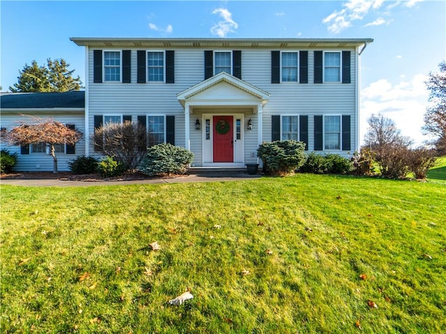 colonial home with a front yard