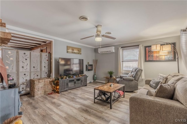 living room with a wall mounted air conditioner, hardwood / wood-style floors, ceiling fan, and crown molding