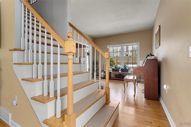 stairway with wood-type flooring