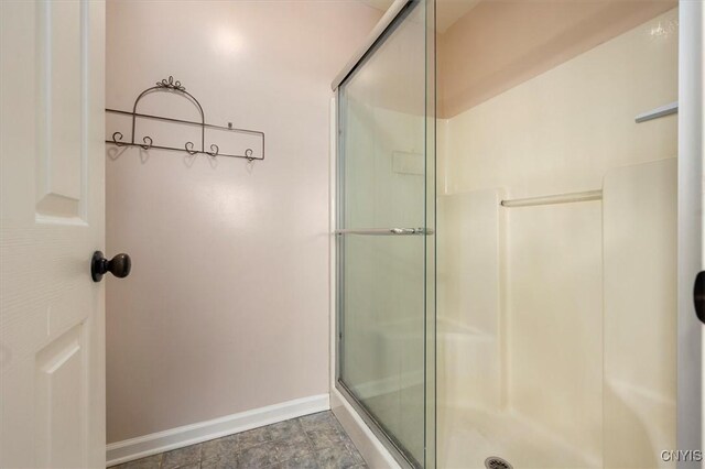 bathroom with a shower with shower door