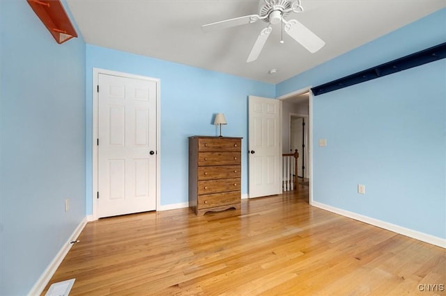 unfurnished bedroom featuring ceiling fan and light hardwood / wood-style floors