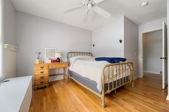 bedroom with ceiling fan and light wood-type flooring